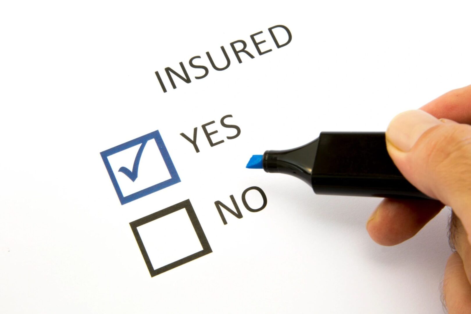 A person is filling out an insured questionnaire.